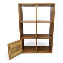Indigo Furniture - rustic oak shelving unit with cupboard, five open shelves with a cupboard to the lower left, metal cup handles