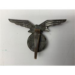 Three WW2 German visor cap badges comprising Police eagle, Political leaders eagle and Norwegian Quisling Party; all with fixings; and WW2 Polish visor cap badge (4)
