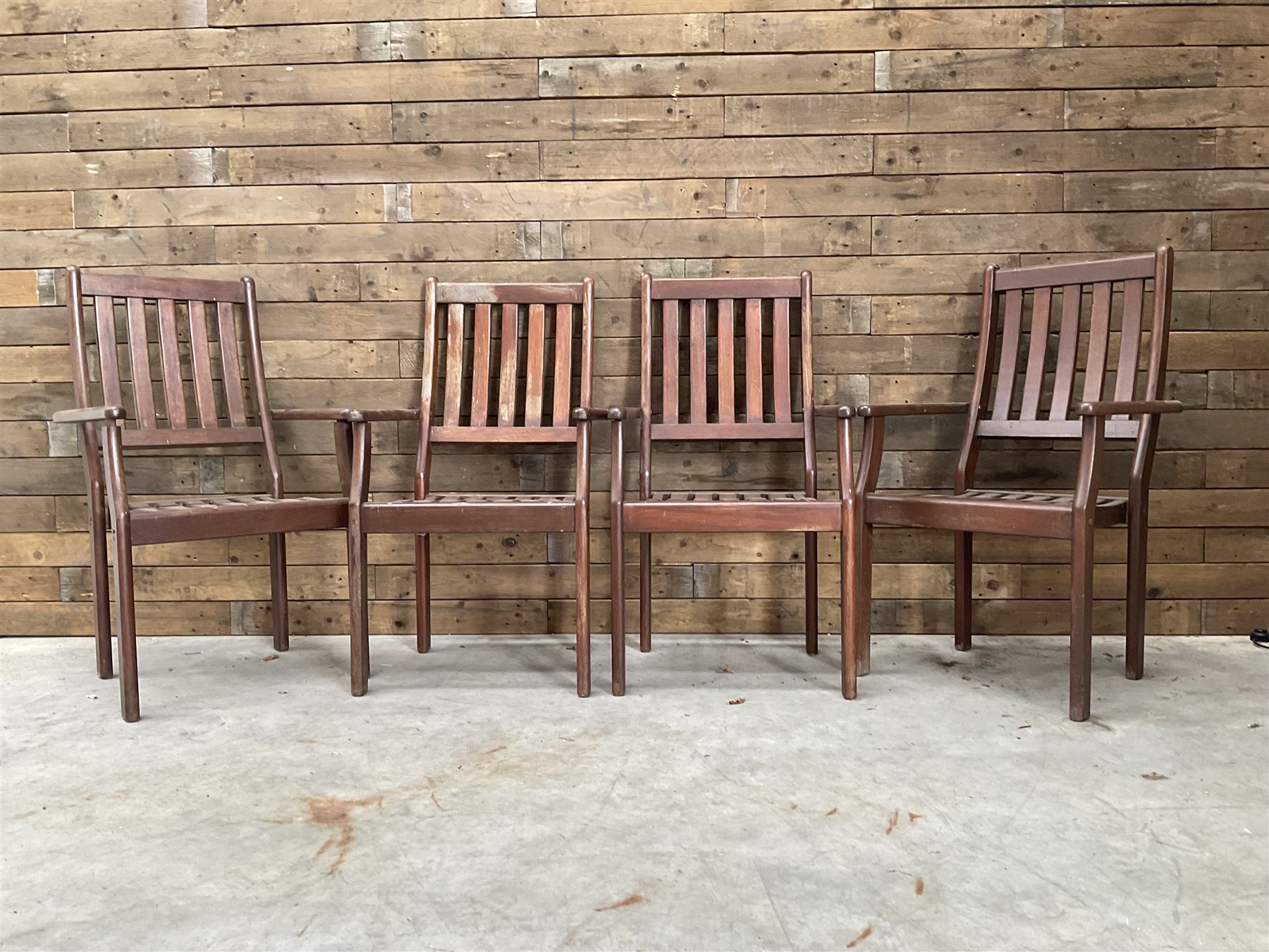 Set of eight hardwood garden armchairs