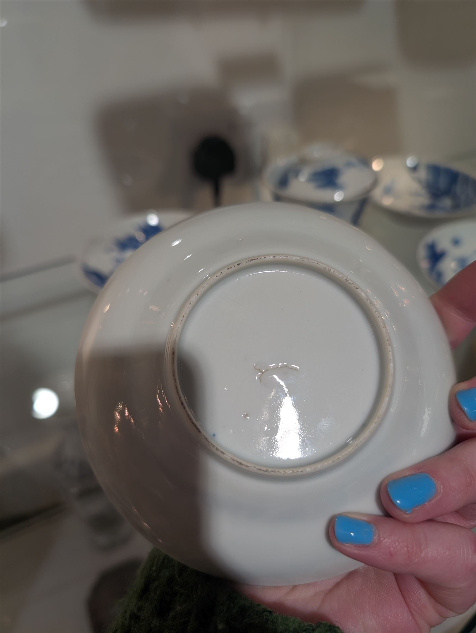 Pair of Chinese blue and white tea bowls, one with cover and four saucers, depicting two figures on a boat at sea, tea bowl H7cm