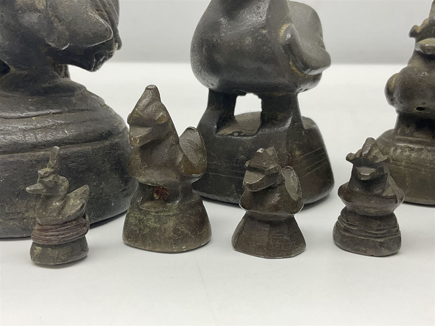 19th century graduating set of Burmese bronze opium weights, in the form of Hintha birds, tallest H11.5cm (8)