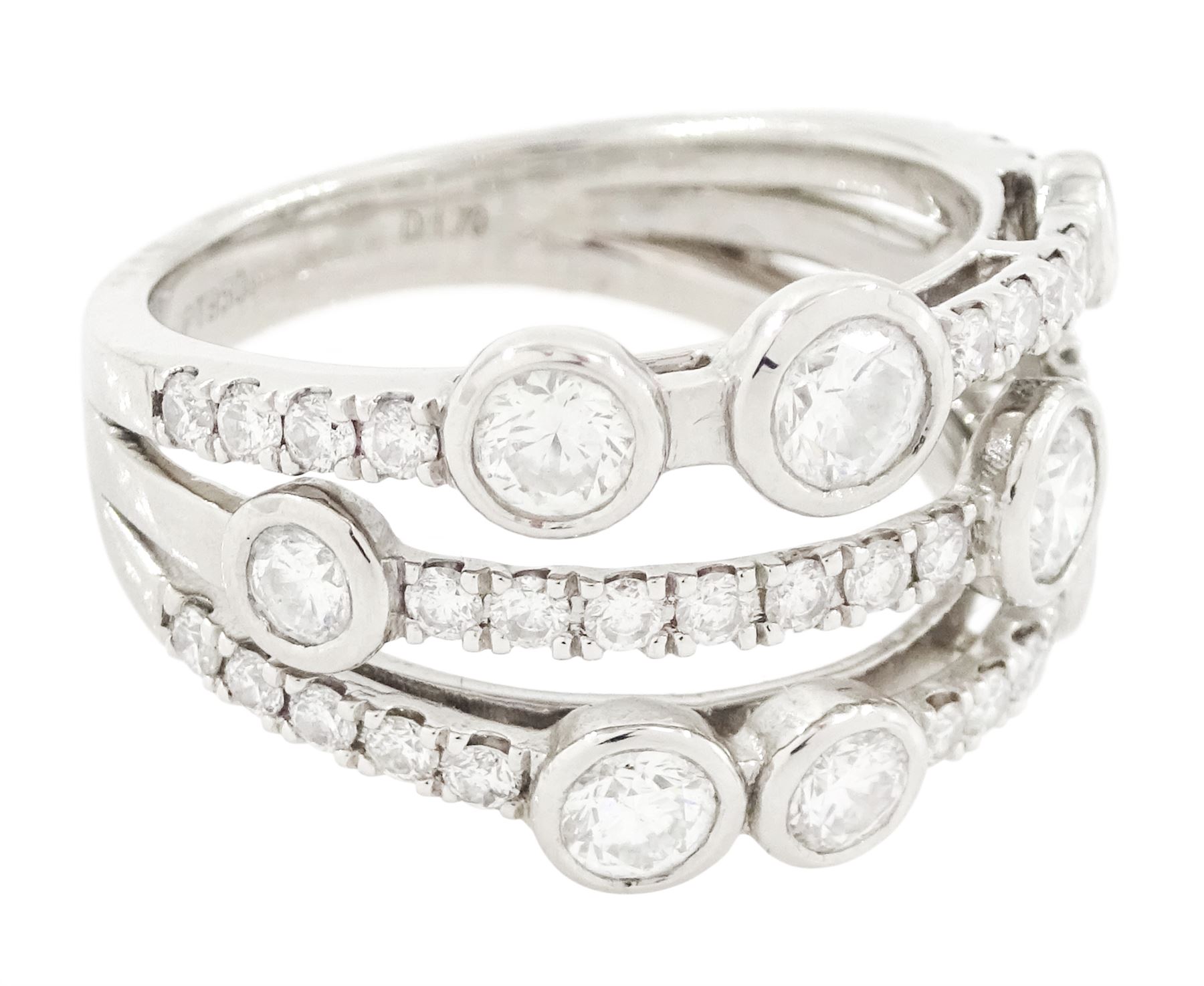 Platinum diamond three row split design ring, nine bezel set round brilliant cut diamonds, spaced by smaller round brilliant cut diamonds, hallmarked, total diamond weight 1.70 carat 