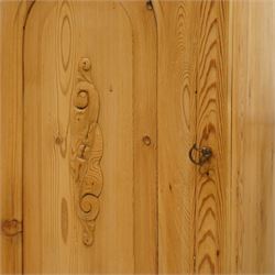 Pair of early 20th century pitch pine bedside cabinets, door with applied foliate carving, raised on cabriole legs