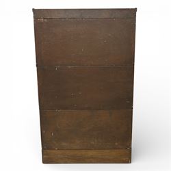 Globe Wernicke - early 20th century three sectional stacking library bookcase, two glazed sections above a panelled section, on a plinth base with inbuilt drawer