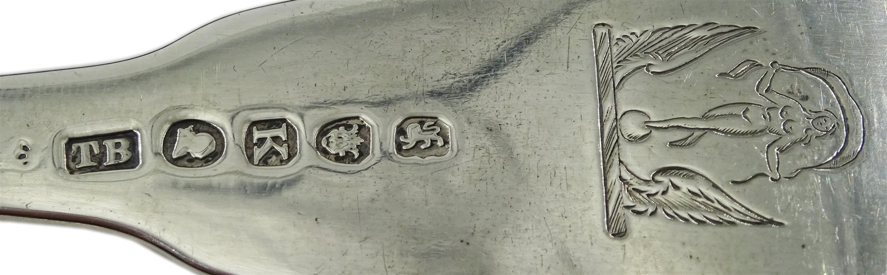 George III silver berry spoon by Solomon Hougham, London 1801 and a George III silver fork, fiddle pattern with bright cut floral decoration by Thomas Wilkes Barker, London 1805, approx 4.5oz