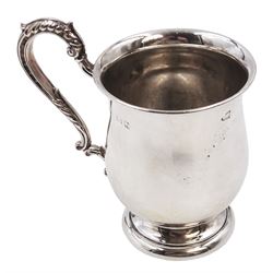 1930s silver Christening mug, of plain waisted form, with acanthus capped scroll handle, upon stepped circular foot, hallmarked Barker Brothers Silver Ltd, Birmingham 1933, including handle H10cm 
