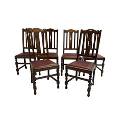 Set six early 20th century oak dining chairs, shaped cresting rail over pierced splat, drop in upholstered seats, on turned supports joined by plain stretchers