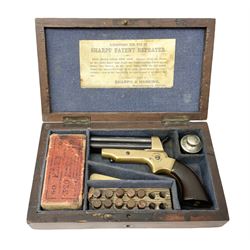 Mid-19th century Sharps' Patent Repeater four-barrelled Deringer pistol, dated 1859, approximately .30 calibre rim fire, brass bodied with rotating firing pin, serial no.8767, L16cm; in fitted rosewood box with label under lid, rack of ten deactivated cartridges, oil bottle and screwdriver and owner's name in brass cartouche to lid.