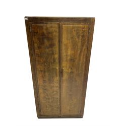Early 20th century scumbled wood wardrobe, two panelled doors enclosing shelf over hanging rail