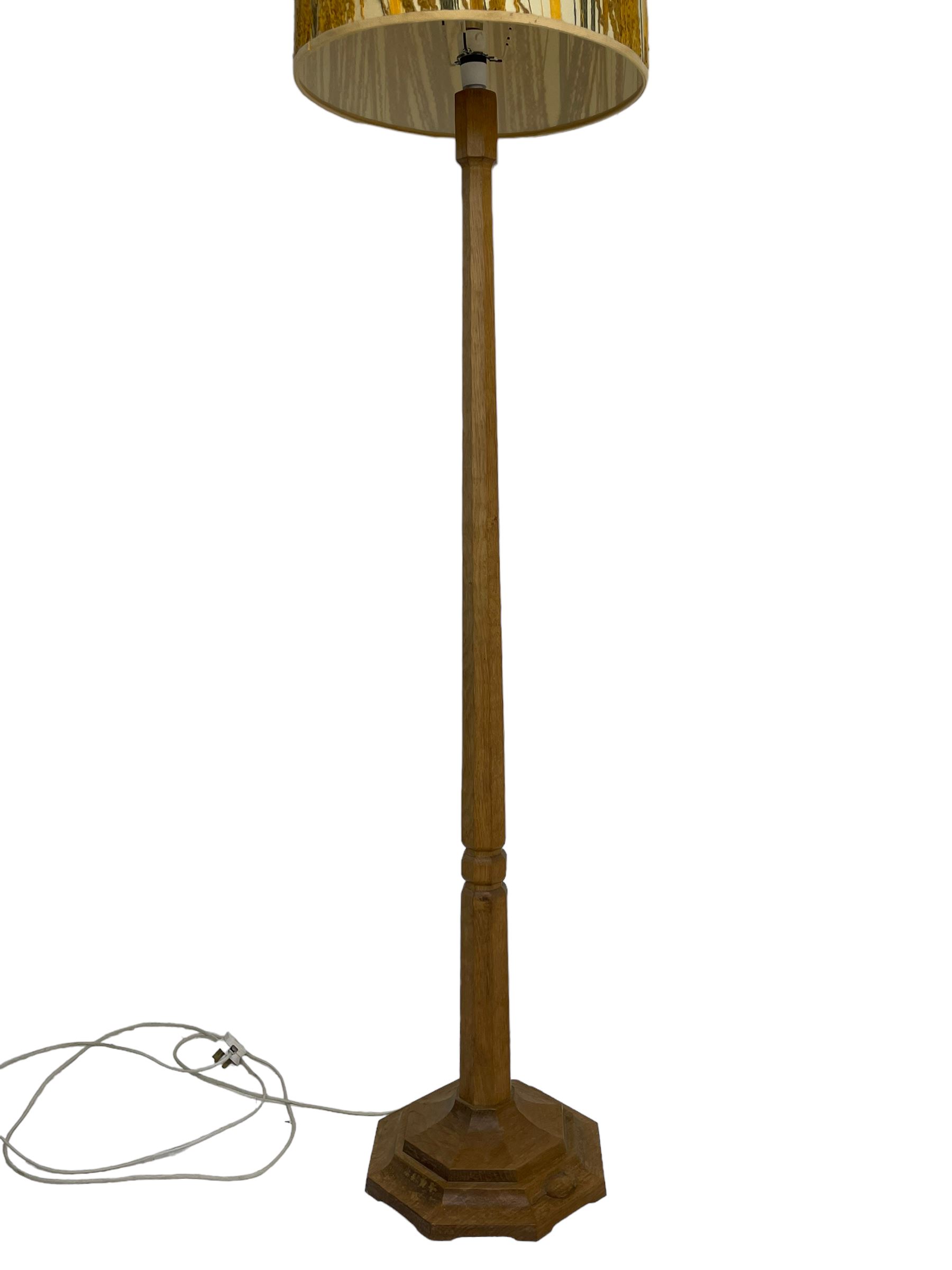 Mouseman - oak standard lamp, octagonal tapered column on octagonal base carved with mouse signature, by the workshop of Robert Thompson, Kilburn