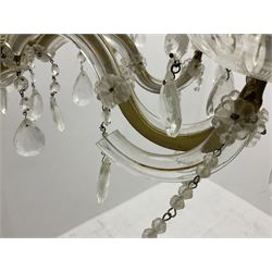 Victorian style glass eight branch chandelier, with drip trays, brass tone support, and drops