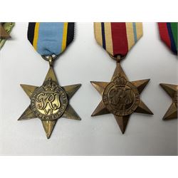 Representative display of WWII Campaign stars comprising 1939-1945 Star, Atlantic Star, Air-Crew Europe Star, Africa Star and Pacific Star; together with the corresponding group of miniatures; all with ribbons