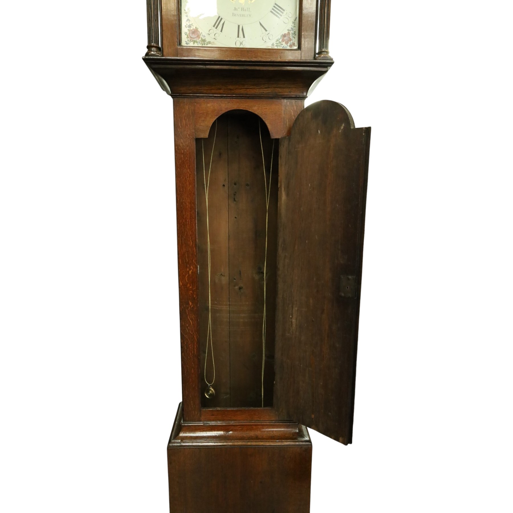 John Hall of Beverley - George III oak eight-day longcase clock, the painted arched dial with subsidiary seconds and date aperture, floral decoration, the case with pagoda top, pierced fretwork panel, brass ball finials, fluted pilasters and arched trunk door