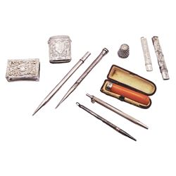 Group of small silver items, to include Victorian silver vesta case, with engraved foliate decoration and monogramed cartouche, hallmarked Joseph Gloster, Birmingham 1894, Edwardian silver match box case, hallmarked Birmingham 1904, makers mark worn and indistinct, an early 20th century amber cheroot holder with silver collar, hallmarked Singleton & Cole Ltd, Birmingham 1913, in fitted case, four silver cased pencils, three examples marked Sterling Silver, one hallmarked Johnson, Matthey & Co, London 1946, etc., approximate weighable silver 1.35 ozt (42 grams)