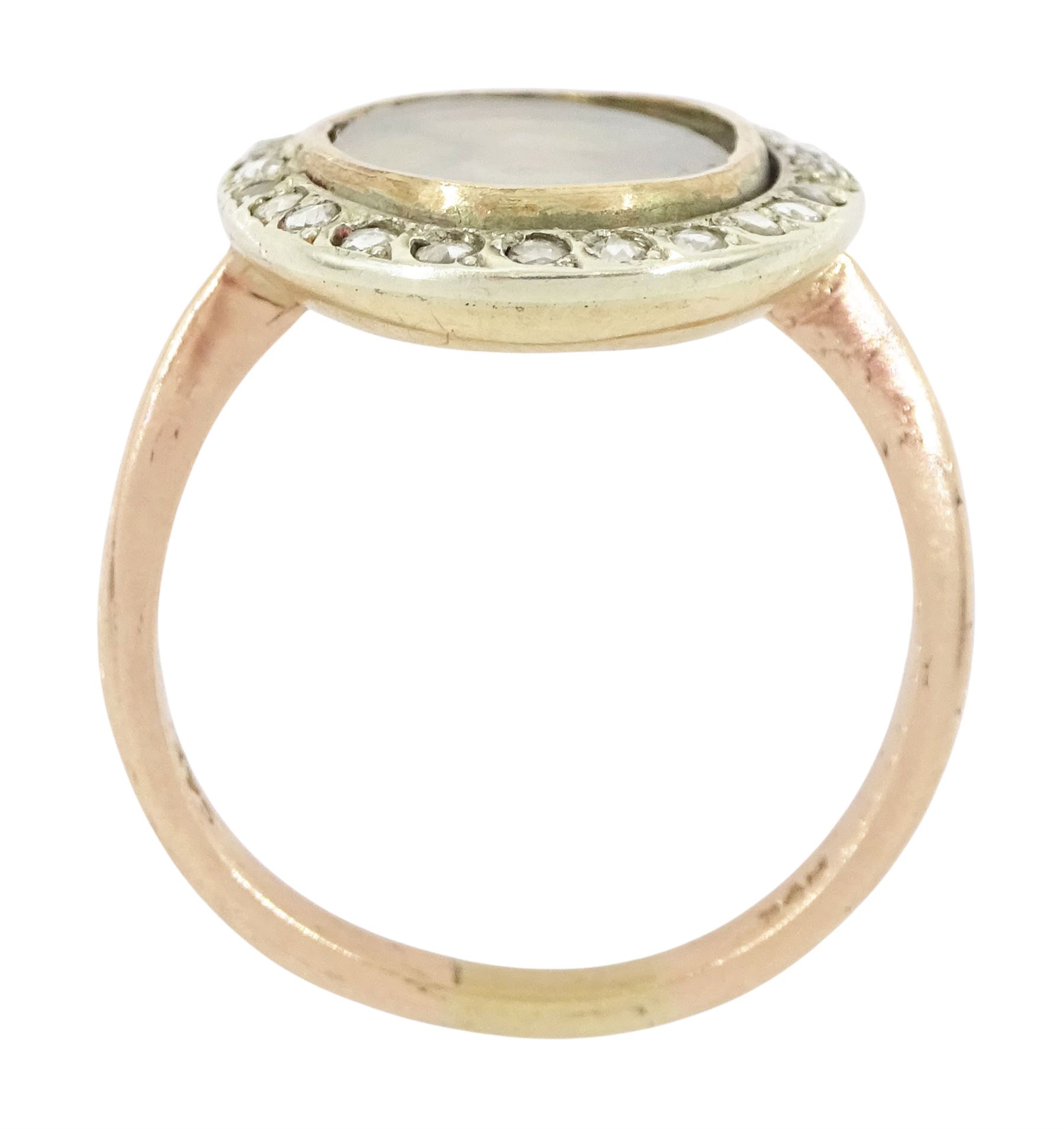 19th century 9ct gold diamond portrait ring, set with an oval miniature of a woman in 18th century dress on ivory, under a glazed panel, with rose cut diamond surround, on later shank. This lot has been registered for sale under Section 10 of the APHA Ivory Act