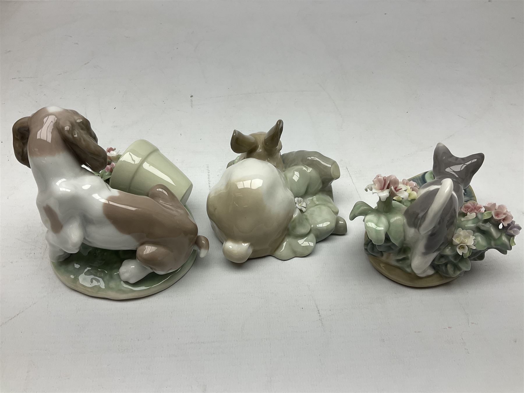 Six Lladro figures, comprising Naughty Dog no 4982, Best Friend 7620 and My Buddy no 7609, Kitty Confrontation no 1442, It Wasn't Me no 7672 and Rabbit Eating no 4772, three with original boxes, largest example H22cm