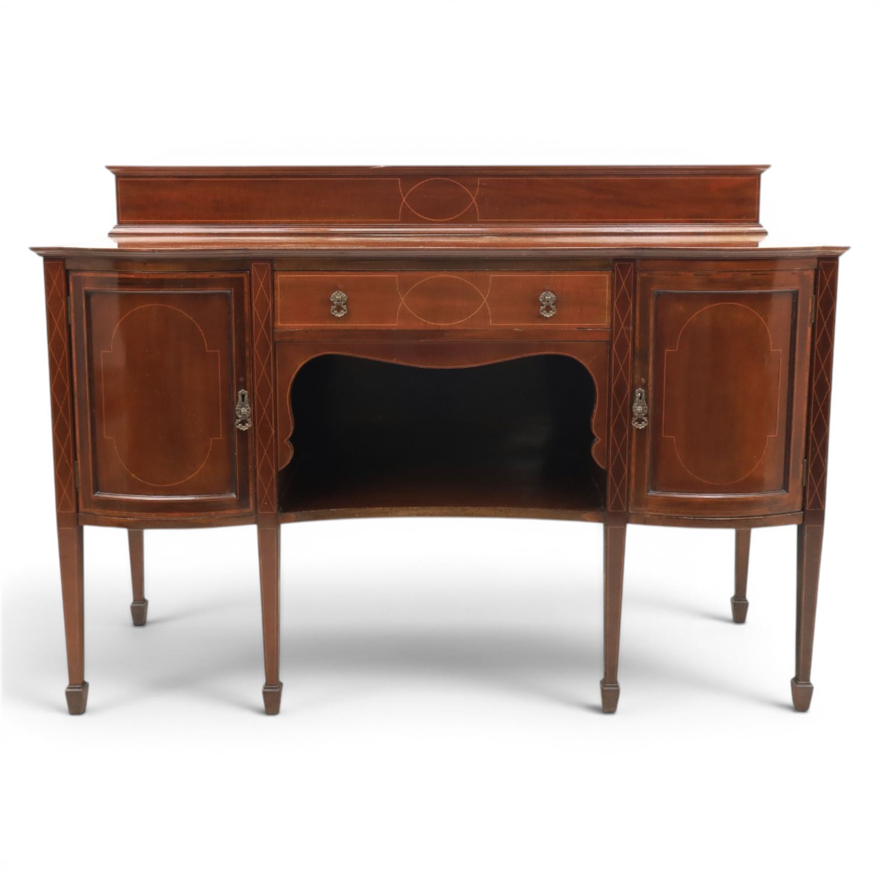Edwardian mahogany and satinwood sideboard, shaped top with galleried back, with freize drawer flanked by two cabinets, united by undertier, raised on square tapering supports terminating in spade feet