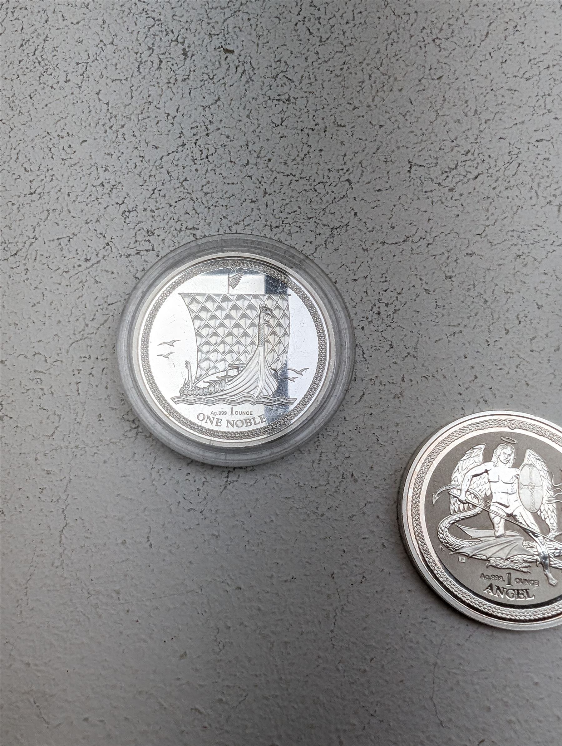 Three Queen Elizabeth II Isle of Man one ounce fine silver coins, comprising 2016, 2018 one angels and 2018 one noble 