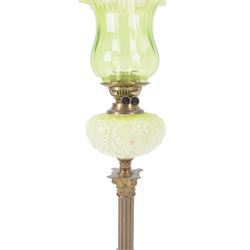 Green glass and brass oil lamps, with frilled glass shade, reservoir decorated with flowers, upon corinthian column with square base, H74cm