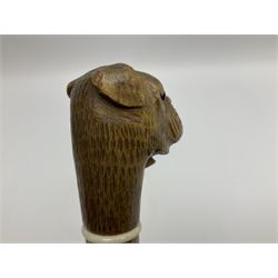 20th century walking cane, the carved wooden handle modelled as the head of a boxer dog with inset glass eyes and articulated and sprung jaw, upon a tapering Malacca shaft, L86.5cm