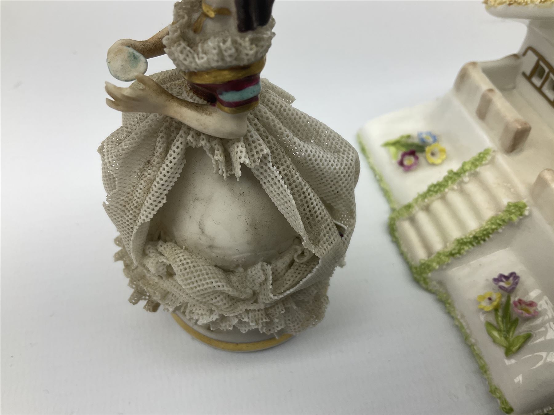 Group of figures, comprising six Royal Doulton examples, Daydreams HN1731, Silks and Ribbons HN2017, Tom Sawyer HN2926, Marie HN1370, Bo-Peep HN1811, and Tinkle Bell HN1677, together with a Dresden type 'lace' example, and a Coalport 'Swiss Cottage', (8)