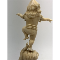 A large Japanese carved ivory okimono, modelled as a figure stood upon one leg with arms outstretched, upon a five headed serpent emerging from waves, H30cm.