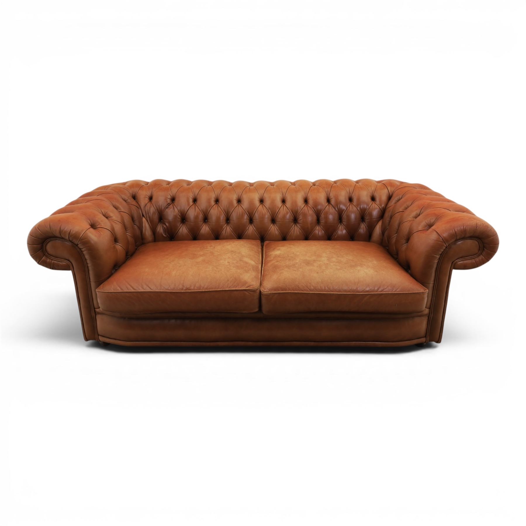 Springvale - Large three seat Chesterfield sofa, upholstered in buttoned tan leather, two cushion deep seat, turned bun feet