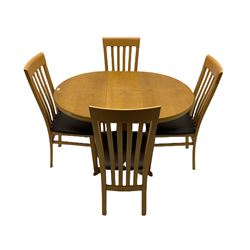 Light oak circular extending dining table and four chairs 