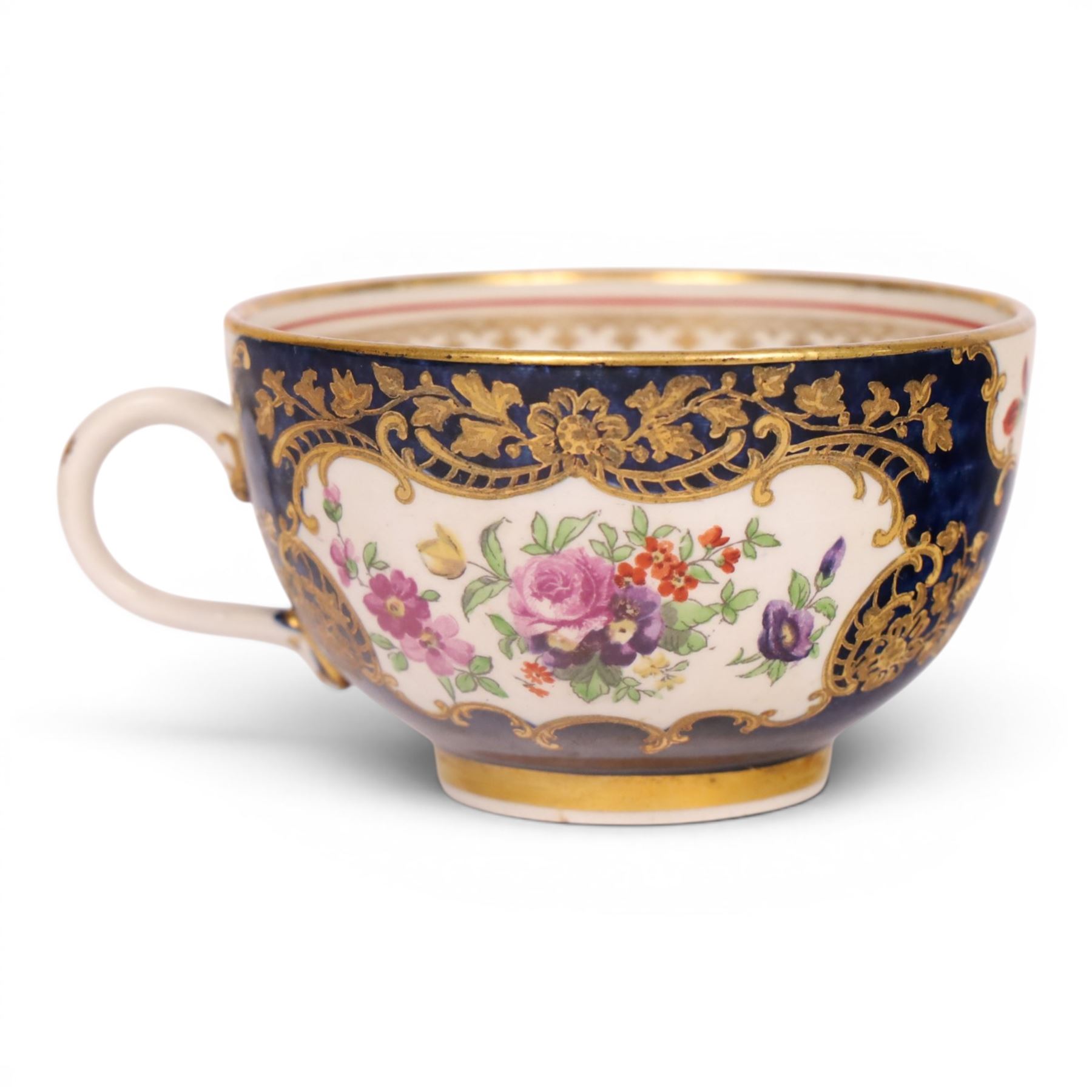 18th century Worcester trio, circa 1770,  painted with shaped panels of birds within a gilt boarder upon a blue scale ground with gilt detail to the rim, mark beneath, H7cm 