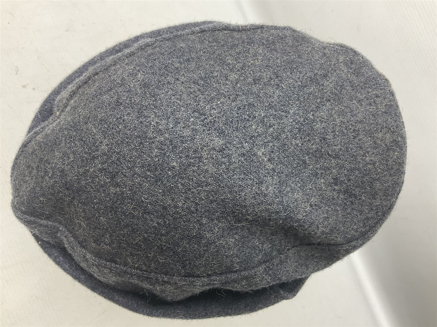 WW2 German Luftwaffe M43 field cap with triangular cloth eagle and roundel badge; marked '1944 ?/0501/0015 57'