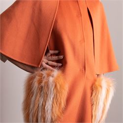 Fendi Roma - wool cape coat in 'Cayenne' orange peach, with concealed front fastening and short flared cape sleeves, applied with dyed arctic fox fur patch pockets, size 40, unused with original tags