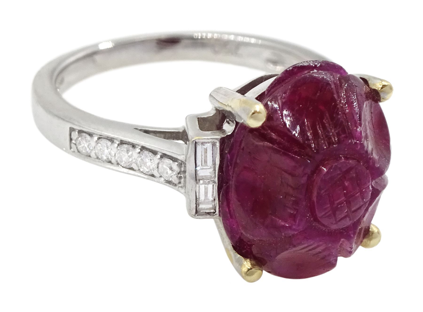 18ct white gold carved ruby ring, set with two baguette cut diamonds either side and diamond set shoulders, ruby approx 6.00 carat