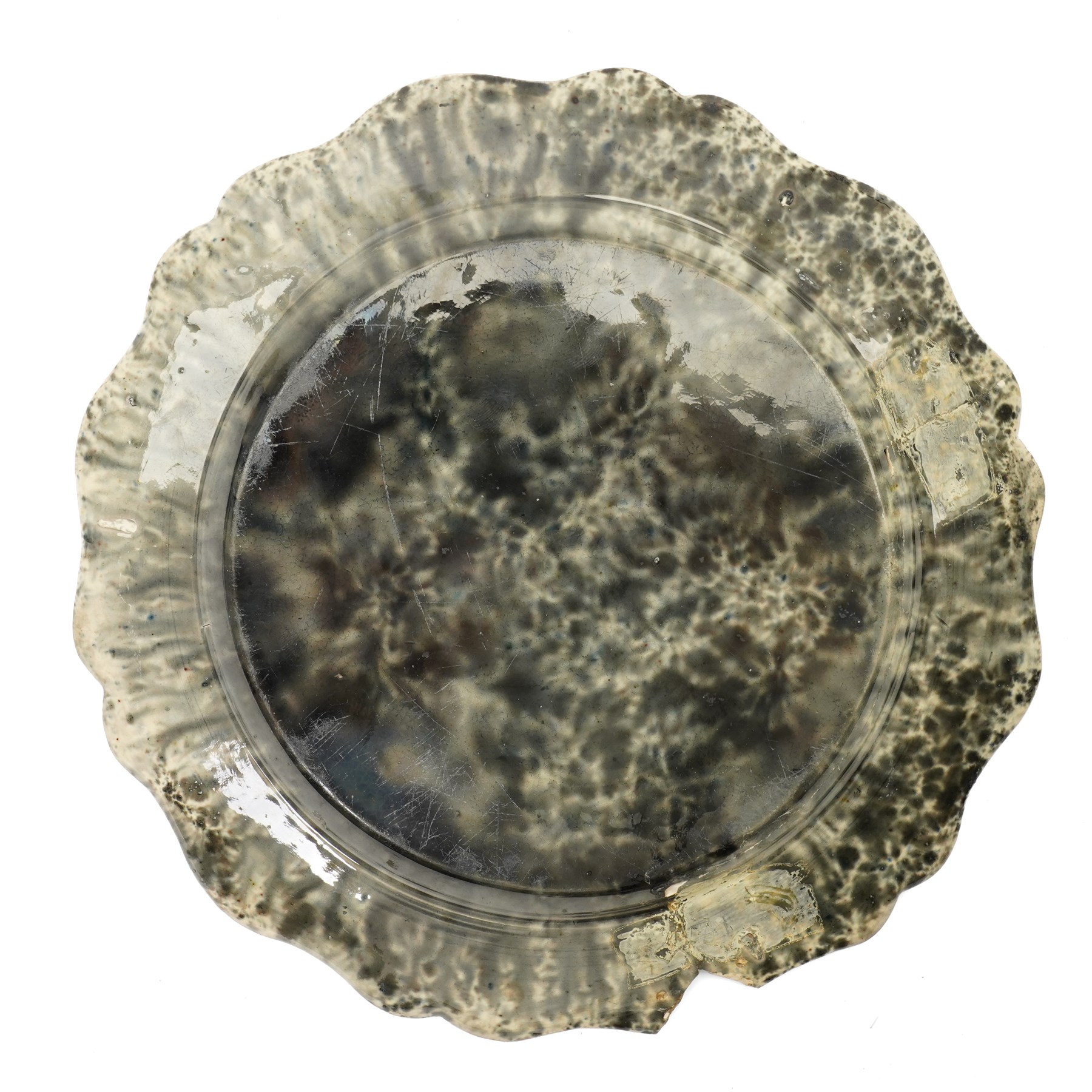 Pair of 18th century cream ware Whieldon type plates decorated with a mottled tortoiseshell glaze D20cm and two other similar plates of shaped circular design