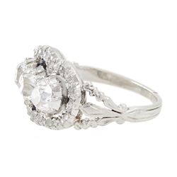 Late 19th / early 20th century platinum diamond ring, three old cut diamonds, in an openwork setting surrounded by further old cut diamonds, with pierced design shoulders, principal three diamonds total weight approx 1.45 carat, in a velvet and silk lined box by Selfridges