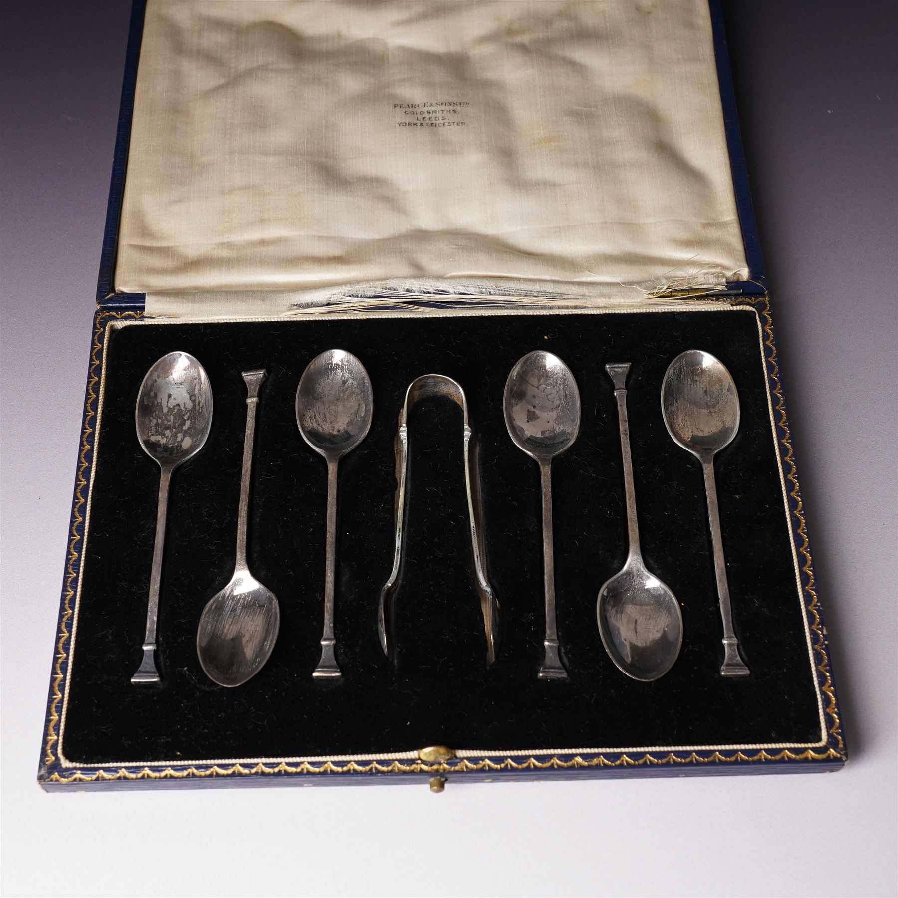 Set of six silver seal top coffee spoons and tongs Sheffield 1924 Maker Cooper Bros & Sons Ltd, cased and a set of six silver bead knop coffee spoons, cased