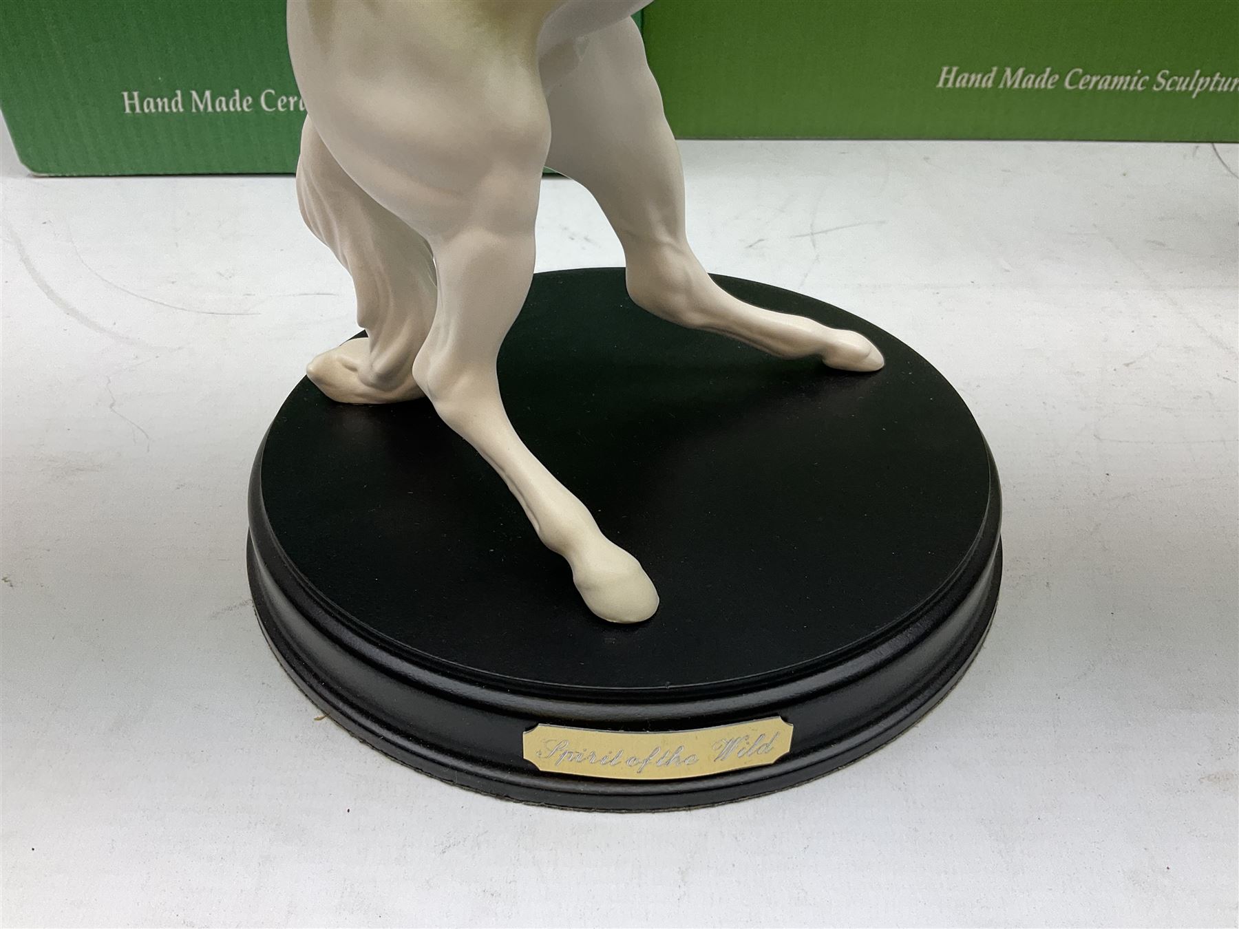 Five Beswick and Royal Doulton horse figures in matt white on black plinths, comprising of  Spirit of Affection no. 2689/2536, Springtime no.2837, Spirit of peace no.2916, Spirit of earth no.2914 and Spirit of the wild no. 183, together with a composite figure of a horse (6)