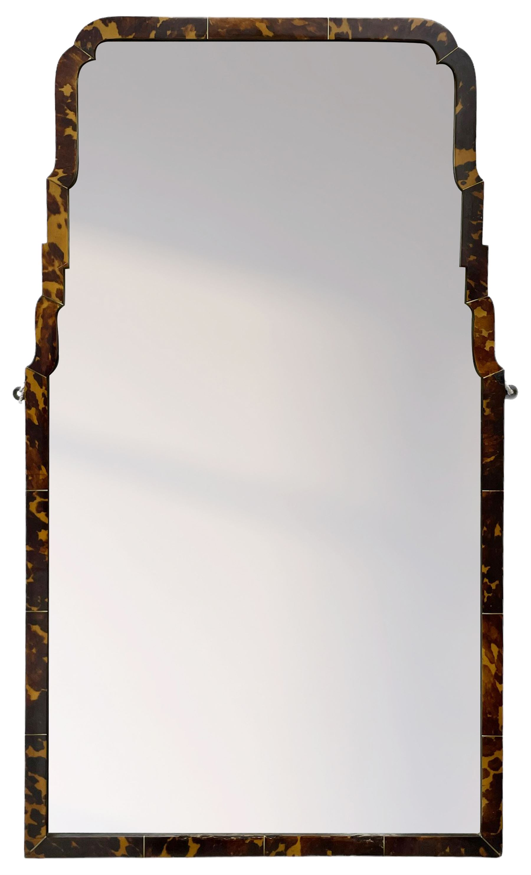 Early 20th century wall hanging tortoise shell framed mirror, of rectangular form, the upper half of the frame shaped and stepped surrounding a plain mirror plate