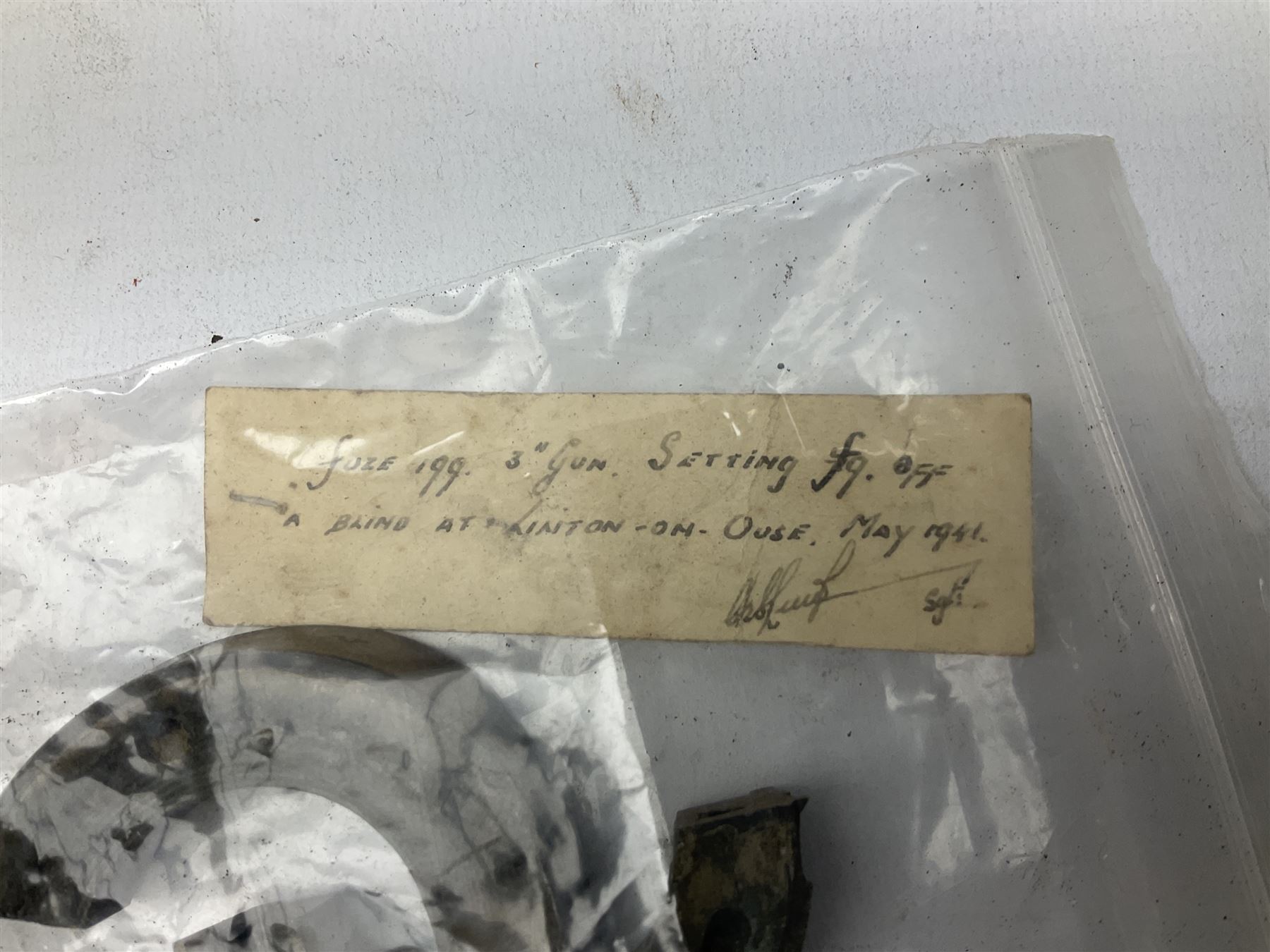 Small collection of WW2 shrapnel and German and British shell parts, most with manuscript details of where and when found including London, Leeds, Bristol, Linton-on-Ouse etc