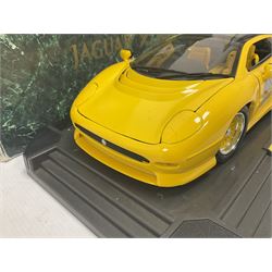 Two Maisto 1:12 scale Jaguar XJ220 ‘Racing’ cars in yellow, both on plinths in original boxes 