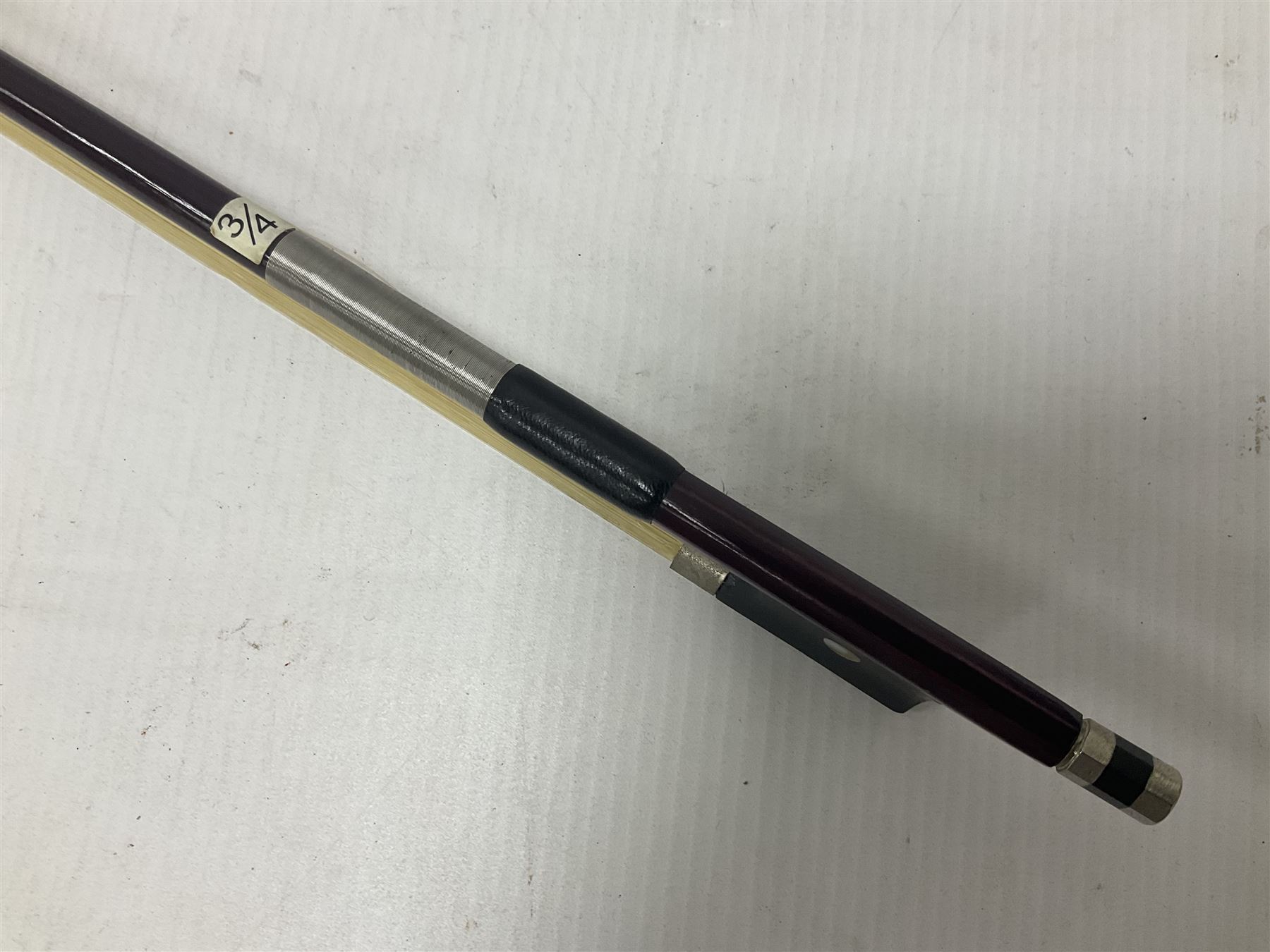 Intermusic 3/4 violin with a violet coloured solid wood body, ebonised fingerboard and fittings, bow and hard case, length 54cm