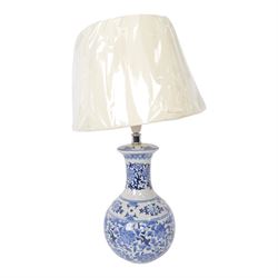 Oriental style blue and white table lamp, with cream shade, H43cm