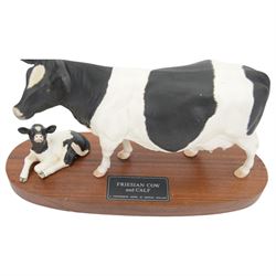 Two Beswick Connoisseur Cattle: Friesian Bull, model and Friesian Cow and Calf, both on wooden plinths, H20cm