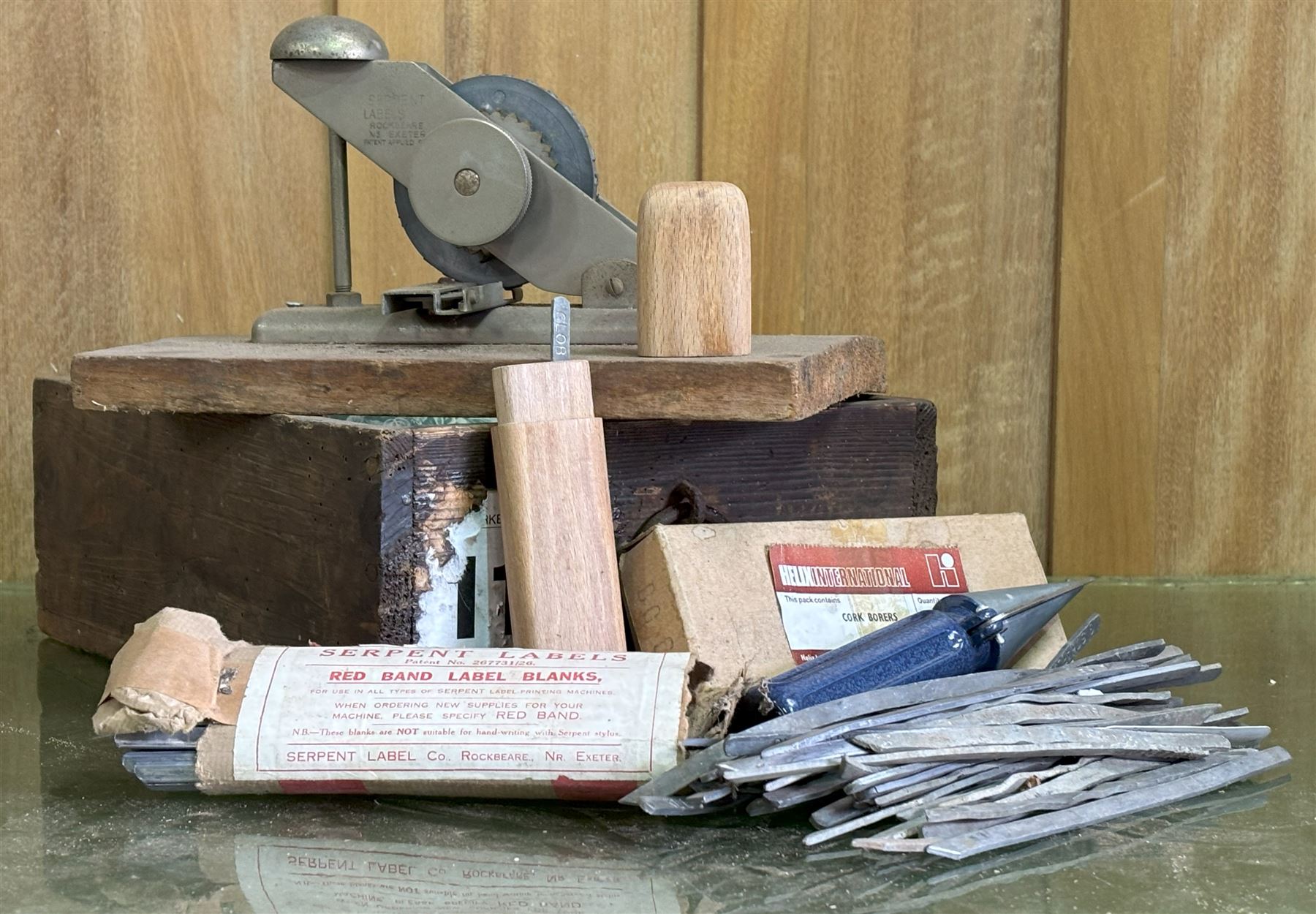 Serpent plant label printing machine, complete with label blanks, together with a set of cork borers and sharpener. 