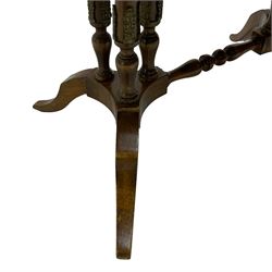 Early 20th century walnut coffee table, oval dished top with sunburst matched veneer, raised on twin cluster columns united by turned stretcher base on splayed supports