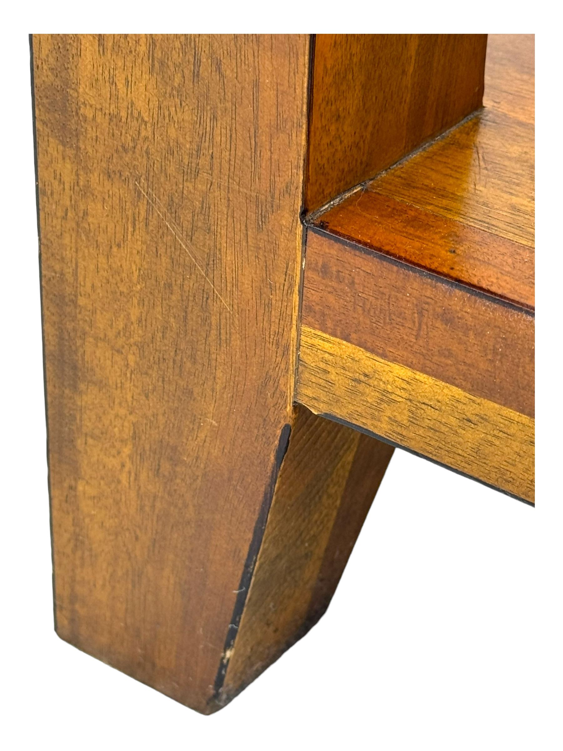 Contemporary hardwood side table, rectangular top over two drawers with shell cup handles, open shelf below, raised on square tapering supports