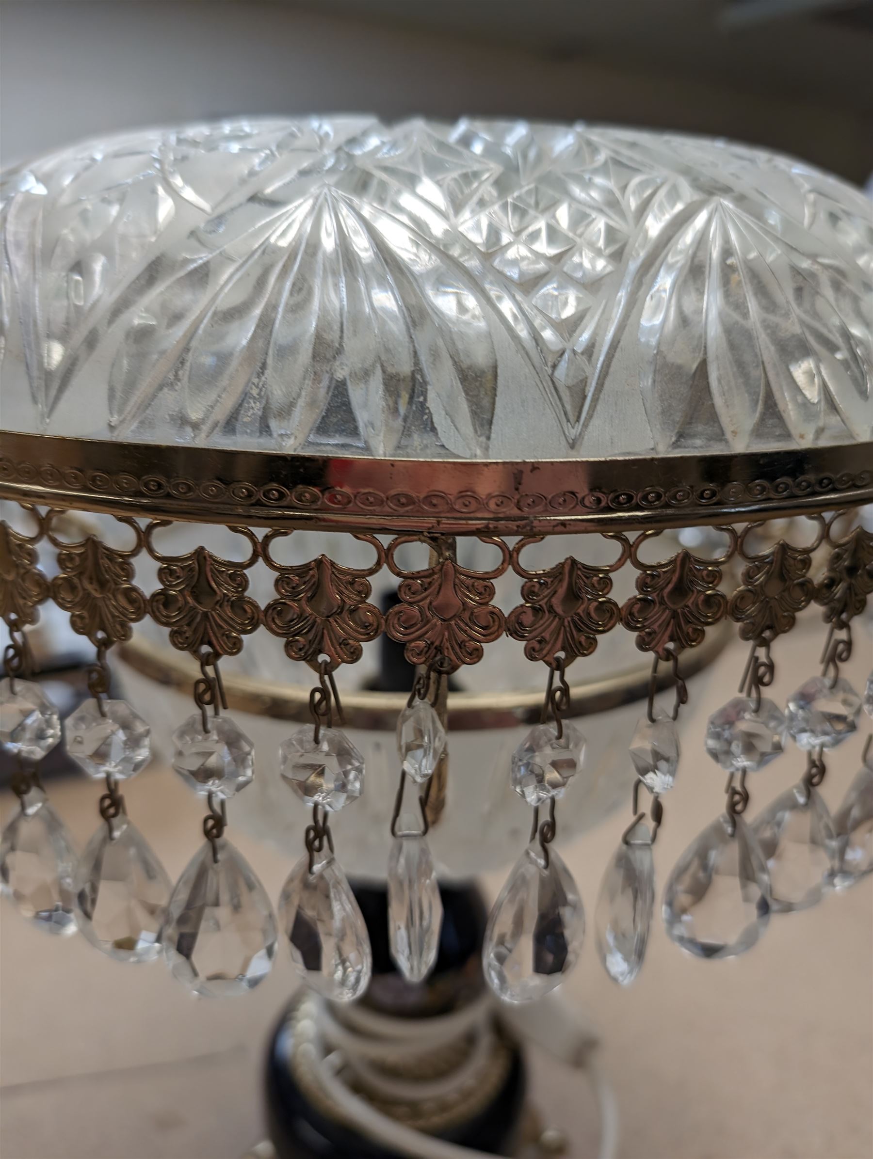 Ceramic table lamp, decorated with florals on a blue ground, with frosted glass shade with glass droplets, with two pin plug