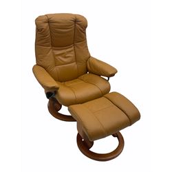 Stressless reclining armchair with matching stool, upholstered in tan leather