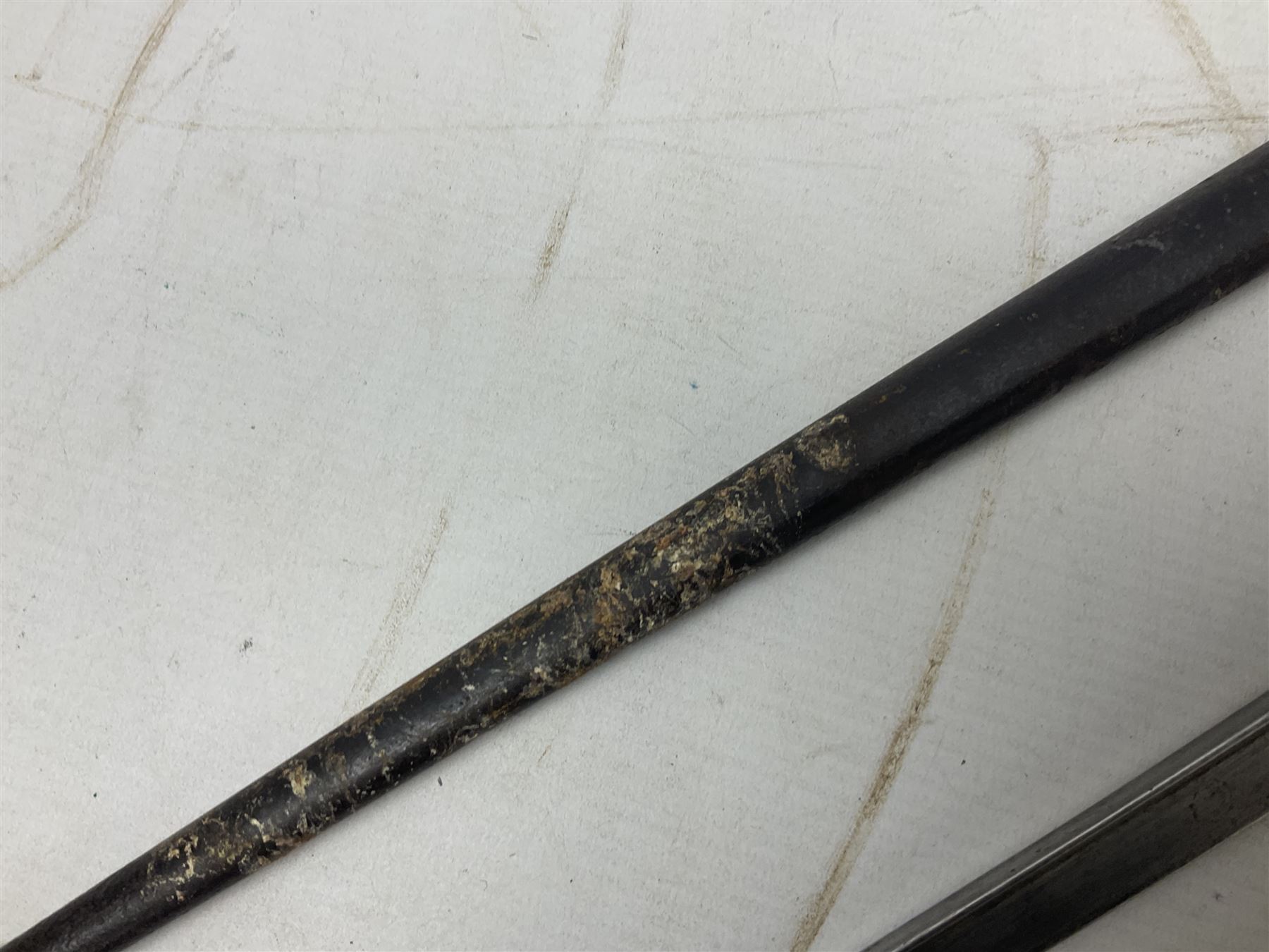 French Model 1874 Epee bayonet marked Oulle 1876 in associated scabbard; Model 1866 sabre bayonet in cut-down sword scabbard; and Model 1842/59 sabre bayonet in relic condition (3)