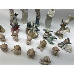 A group of assorted Nao figures, to include examples modelled as girl with lantern and dog, two spaniels, two examples modelled as angels, nine 'Cheeky Cherubs' figures, etc., plus another figure modelled as two doves upon a flowering branch. 