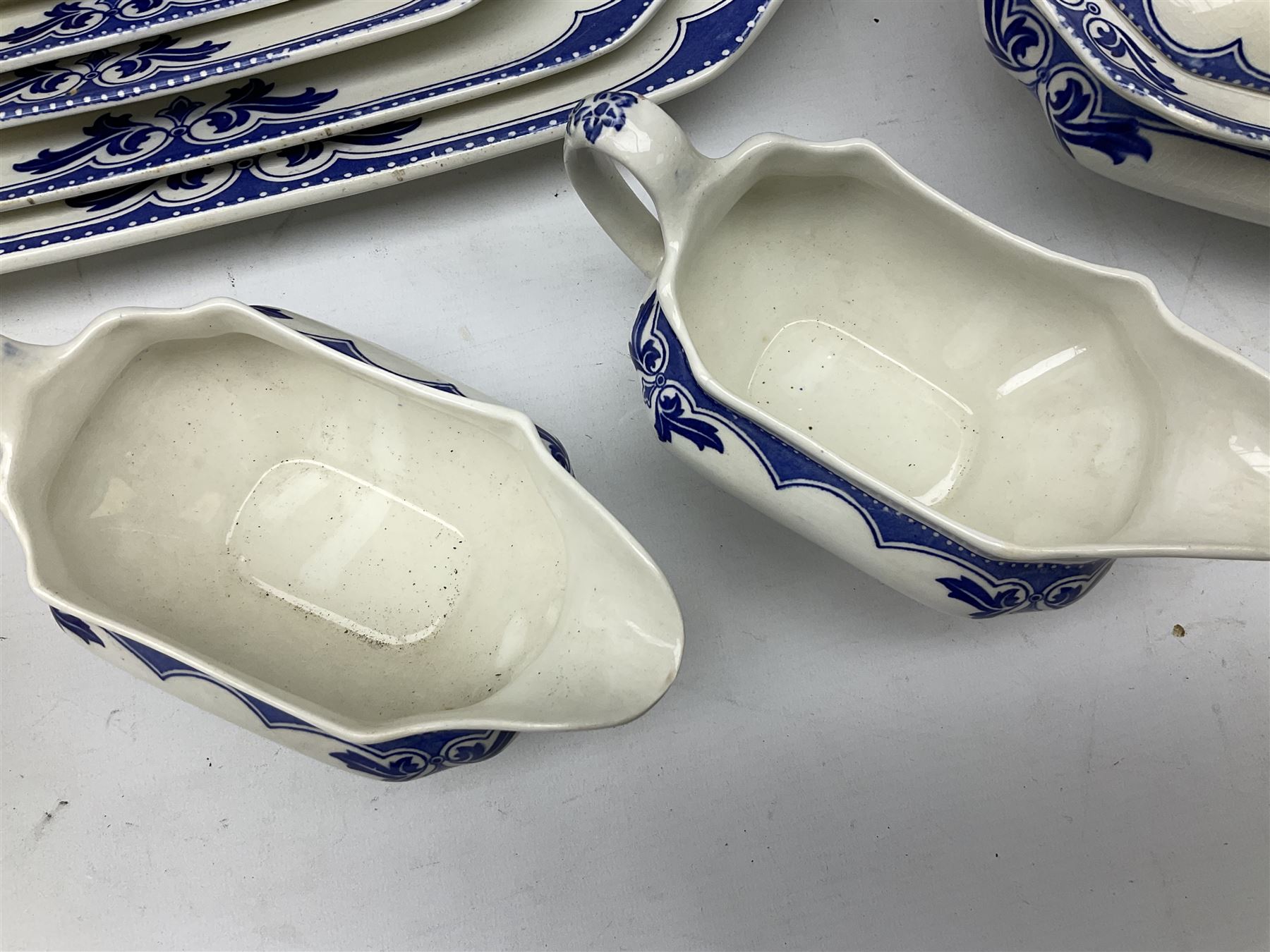 Burgess and Leigh Middleport pottery dinner wares decorated in the ‘Milford’ pattern, to include lidded tureens, graduated meat plates, dinner plates etc 